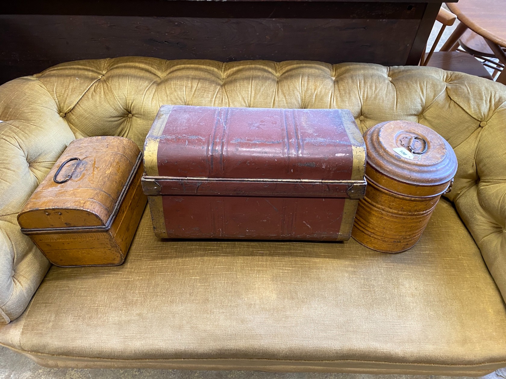 A Victorian painted tin small trunk, 54 cm and a smaller tin trunk and hatbox with simulated wood finish, largest width 55cm, height 33cm